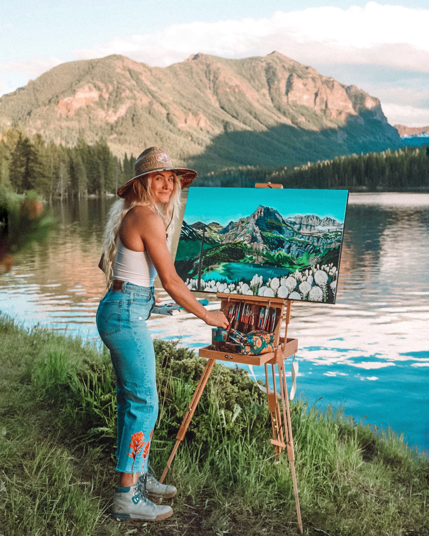 Rachel Pohl posing with her painting.